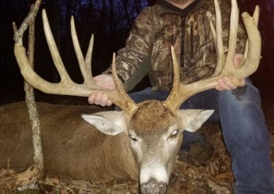 Middle Aged Hunter with Buck