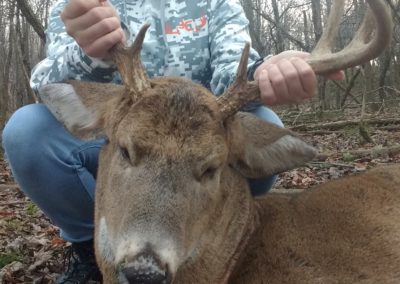 Young girl with small buck