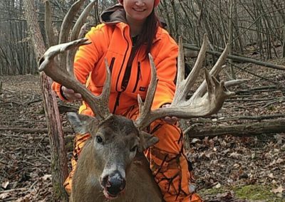 Smiling girl with large buck