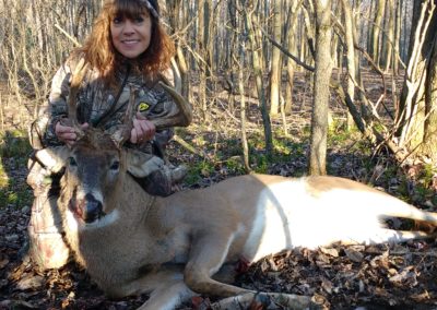 Female ginger hunter with small buck