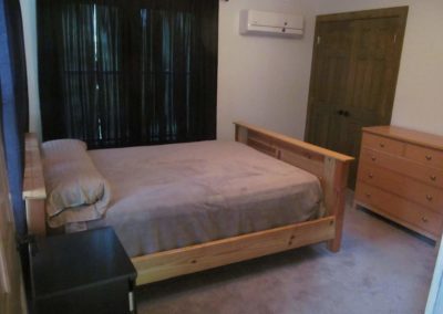 large lodge room with queen bed